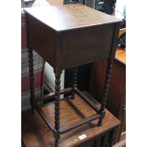 333 - A small oak work box with lift up lid & bobbin turned legs