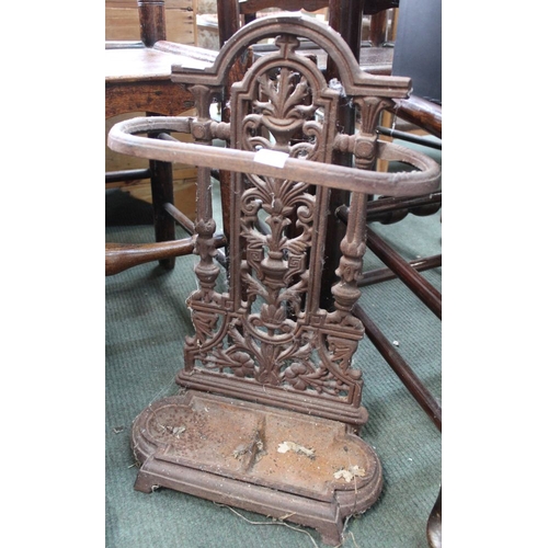 357 - A 19th century cast iron stick/umbrella stand of small proportions with original drip tray