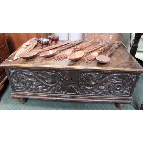 374 - A part late 17th century oak coffer box, hinged lid, front and sides decoratively carved, raised on ... 