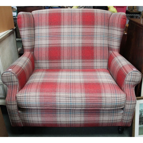 383 - A modern small size two seater wing back sofa in red check upholstery