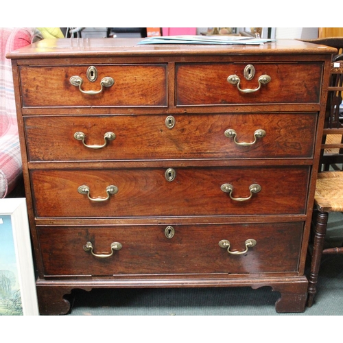 386 - A 19th century mahogany chest of two short over three long drawers with brass handles, on bracket fe... 