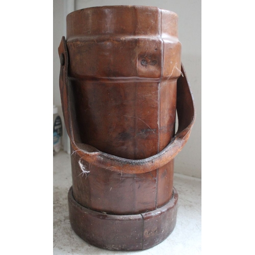 405 - A 19th century leather powder bucket with painted crest