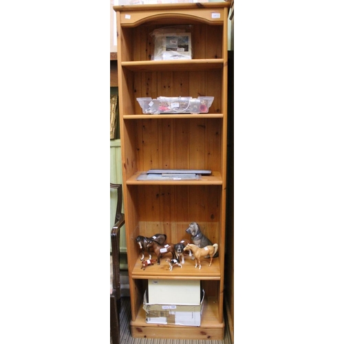 1 - A modern pine slender bookcase with adjustable shelves