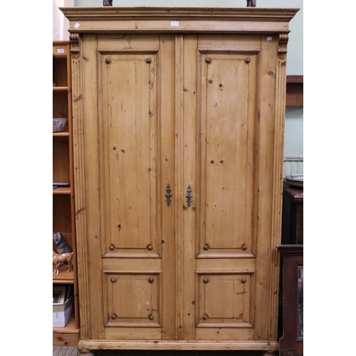 12 - A rustic pine double wardrobe