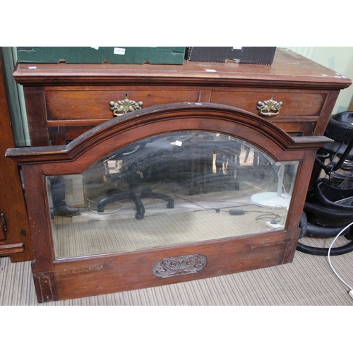 18 - A substantial oak sideboard two small drawers over two large cupboard doors with large arched mirror... 