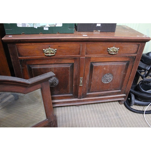 18 - A substantial oak sideboard two small drawers over two large cupboard doors with large arched mirror... 