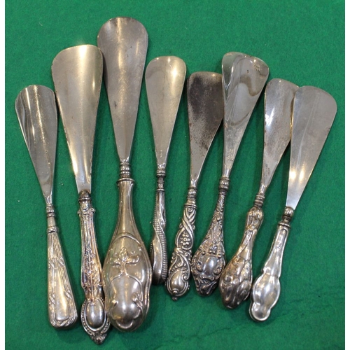 16 - A collection of eight various silver handled shoe horns, together with a small mother of pearl handl... 