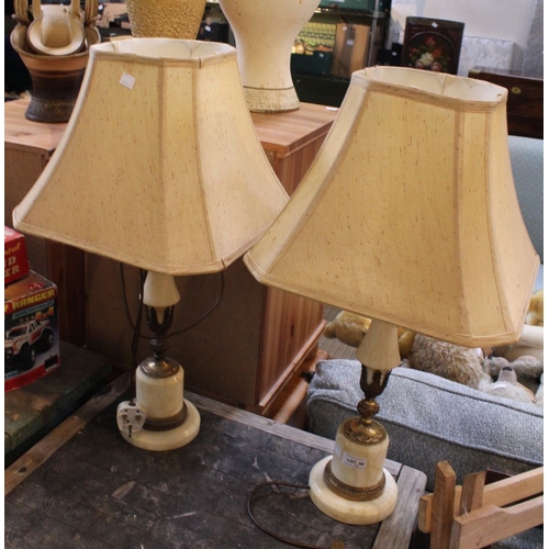 34 - A pair of onyx based table lamps