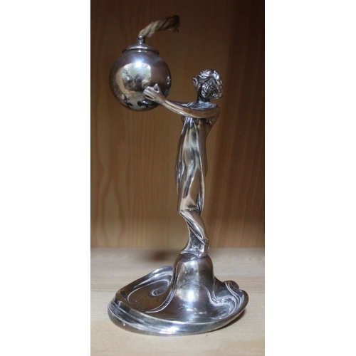 37 - A WMF design Art Nouveau plated metal oil lamp in the form of a Classically draped lady, supporting ... 