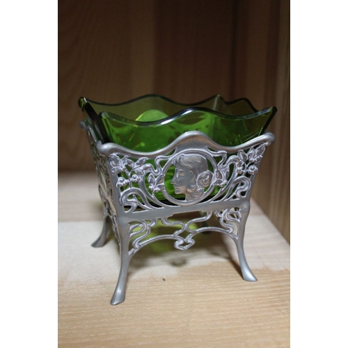 41 - A WMF Metall Warenfabrik Art Nouveau pewter bon-bon dish, the base with mask decoration, fitted gree... 