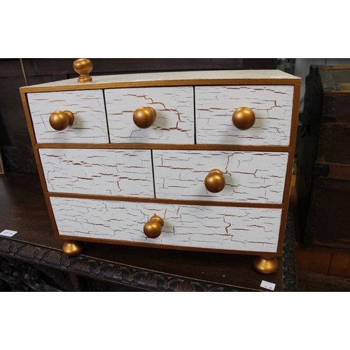 23 - A small chest of table top draws with golden crackle effect paint and golden knobs