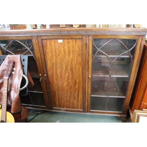 31 - A wooden display cabinet with two glazed doors