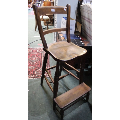 8 - A 19th century tall oak clerks chair with foot rest