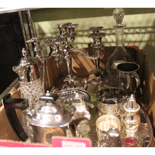 217 - A box of silver plated wares, includes decanter, table candelabra, etc