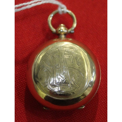 32 - A 9ct gold sovereign holder, with press button opening and attachment ring, engraved monogram, gross... 