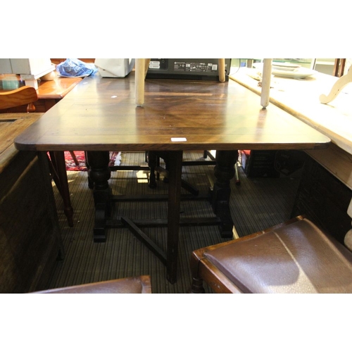 100 - An early to mid 20th century oak drawer leaf table, together with a set of four single chairs with c... 