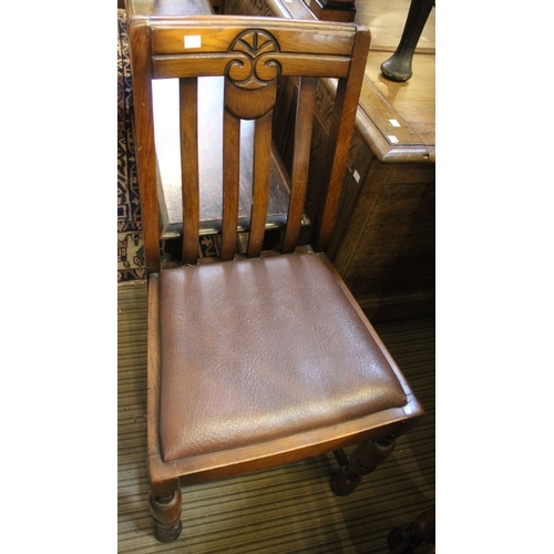 100 - An early to mid 20th century oak drawer leaf table, together with a set of four single chairs with c... 