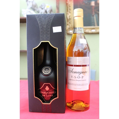 252 - A Courvoisier De Lux Cognac in presentation box and a bottle of VSOP Armagnac