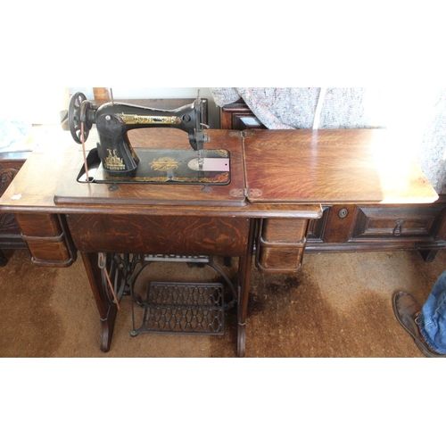 43 - A Singer sewing machine and table