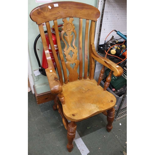 47 - A substantial elm seated yew wood framed open arm fireside chair. Back splay monogrammed 