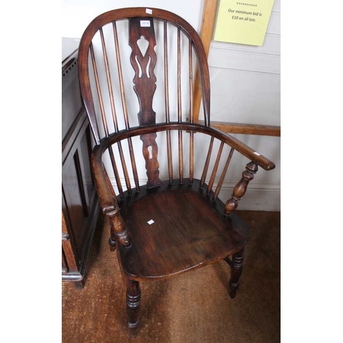 48 - A Windsor design open arm fireside chair, pierced central splat back, elm seat on turned supports wi... 