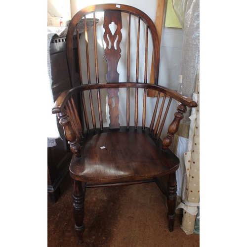 48 - A Windsor design open arm fireside chair, pierced central splat back, elm seat on turned supports wi... 