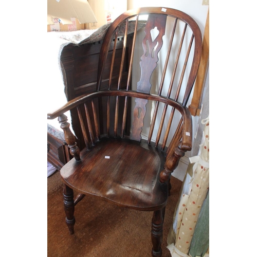 48 - A Windsor design open arm fireside chair, pierced central splat back, elm seat on turned supports wi... 