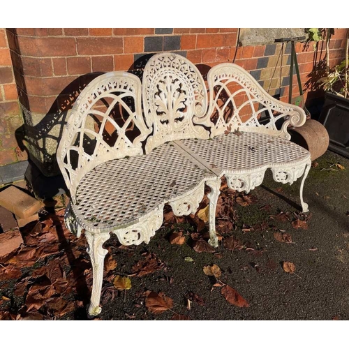 484 - A cast ornate three seater garden bench