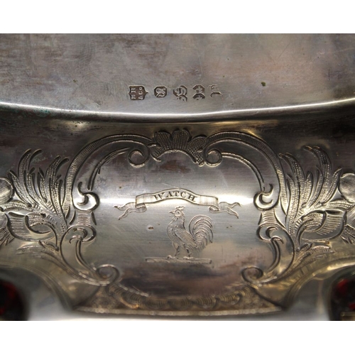 303 - A silver plate standish, with a pair of cut glass inkwells either side of a central taper holder wit... 