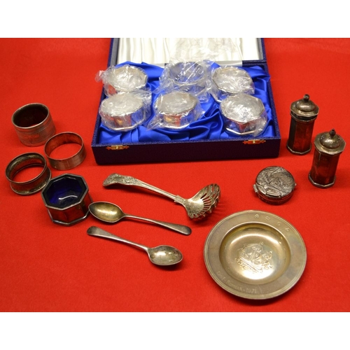 309 - A collection of silver items includes cased set of six napkin rings, condiments embossed pill box et... 