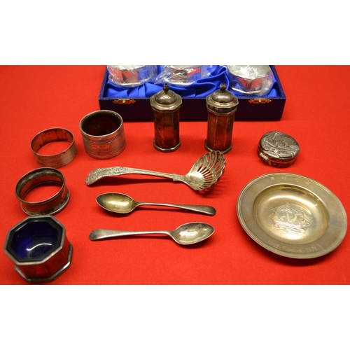 309 - A collection of silver items includes cased set of six napkin rings, condiments embossed pill box et... 