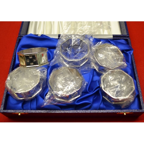 309 - A collection of silver items includes cased set of six napkin rings, condiments embossed pill box et... 