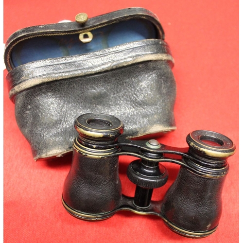 319 - A pair of Paris opera glasses in leather case