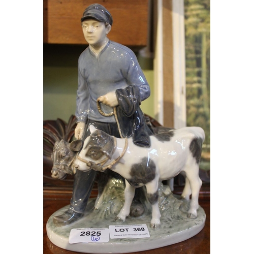 368 - A Royal Copenhagen porcelain figure group of a man with two calves