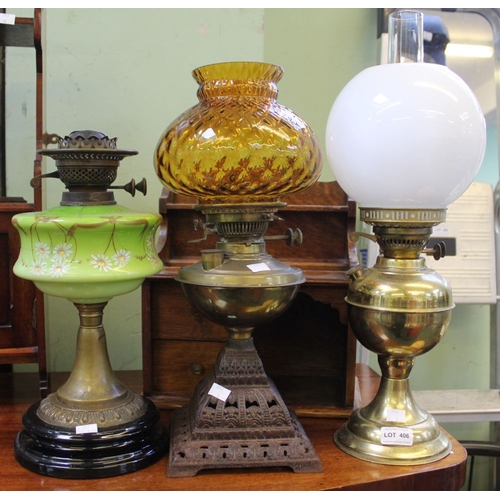 379 - A 19th century pierced metal based paraffin lamp with two further examples (3)