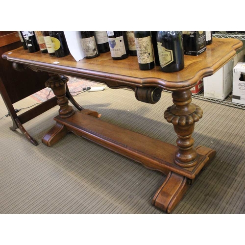 387 - A Victorian design oak & parquetry centre table, having shaped top over cup & cover trestle ends, un... 