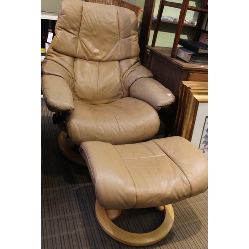 393 - An Ekornes leather swivel recliner chair together with footstool