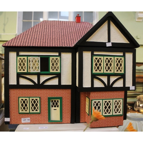 397 - A dolls house, 57cm wide