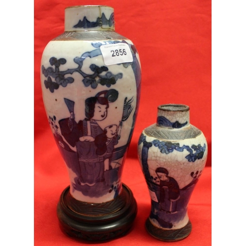 104 - Two Japanese pottery vases, a Guanyin figure and a Temple dog (4)