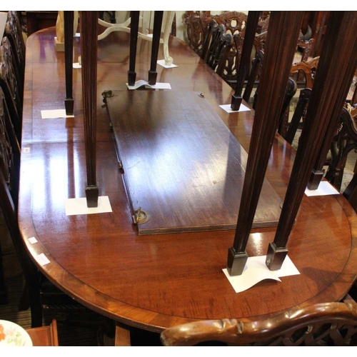 105 - A Regency design mahogany pedestal dining table with leaves, together with matching bow front sidebo... 