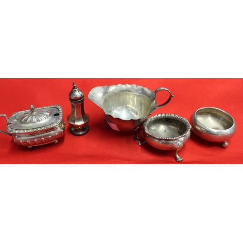 11 - A collection of hall marked silver items, includes two salts, a lidded mustard, a pepper pot and a s... 