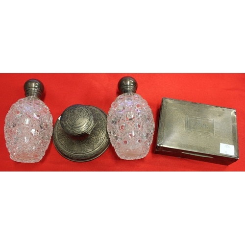 12 - A hallmarked silver capstan inkwell, together with a pair of silver mounted cut glass scent bottles ... 