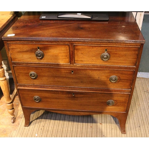 124 - A nineteenth century mahogany small chest of two short over two long drawers, brass handles on out s... 