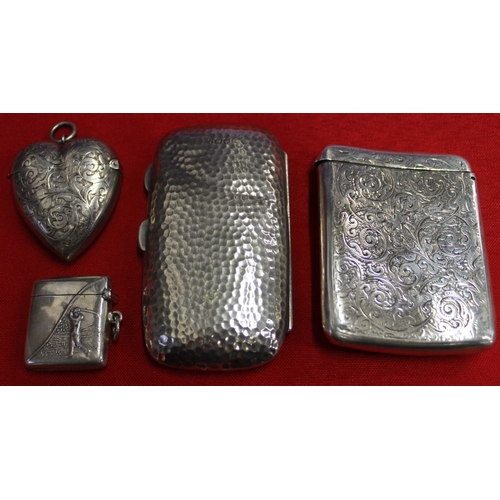 14 - A silver vesta case embossed with a golfer design, a hallmarked silver heart shape vesta, a Victoria... 