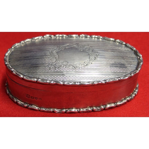 15 - George Nathan and Ridley Hayes, an Edwardian oval silver box, engine turned cover with blind cartouc... 