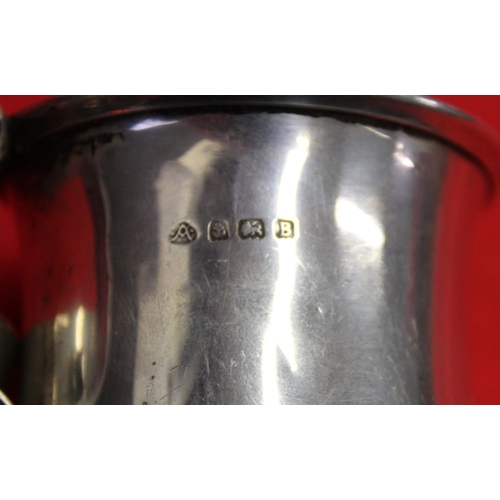 16 - Two hallmarked silver christening tankards, one with remains of a gilded interior, monogramed, combi... 