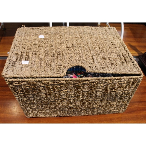 193 - A wicker basket containing a selection of Playstation 2 games