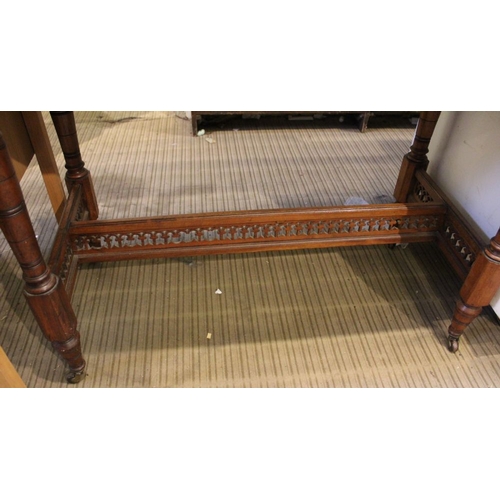 194 - A late Victorian centre table with turned supports and pieced cross stretcher