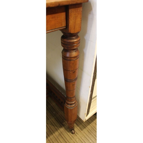 194 - A late Victorian centre table with turned supports and pieced cross stretcher