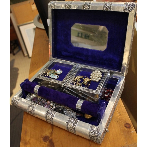 218 - A metal silver coloured jewellery box in the form of two books with contents